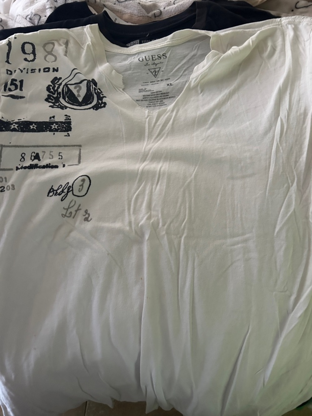 GUESS Men's White Short Sleeve Graphic V-Neck Tee with Black Print